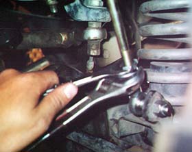 Tighten the jam nust on the end links.